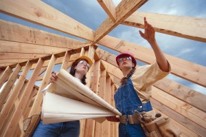 Construction Workers Looking at Roof