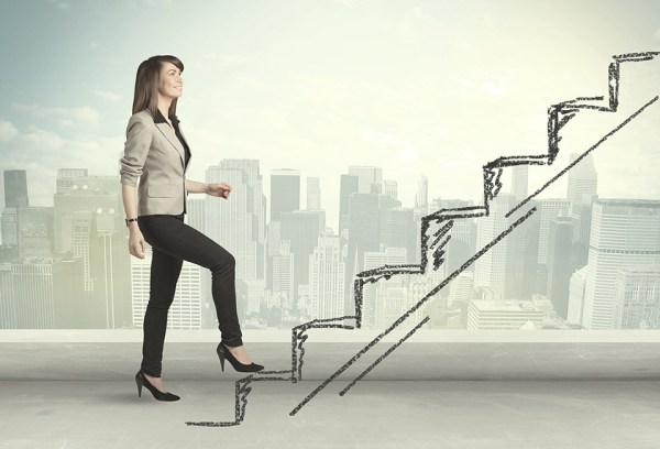 Business woman climbing up on hand drawn staircase concept